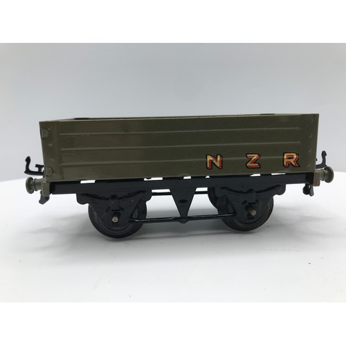 215 - Four Hornby No.1 Wagons, Three NZR and Wakefield Castrol Tanker, NZR Brake Van and NZR Open Wagon in... 