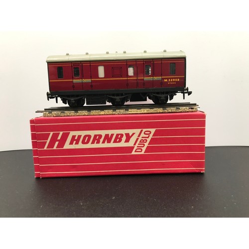 348 - Four Hornby Dublo BR Coaches 4075 (2) 4076 and 4052, All boxed, Two Passenger Brake Vans 4075, Six-W... 