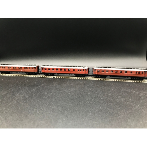 391 - Two 'N' Gauge Rakes, Arnold Speisewagen (3) Good, with Trix SNCF (4) Fair, plus two Trix Coaches, 'R... 