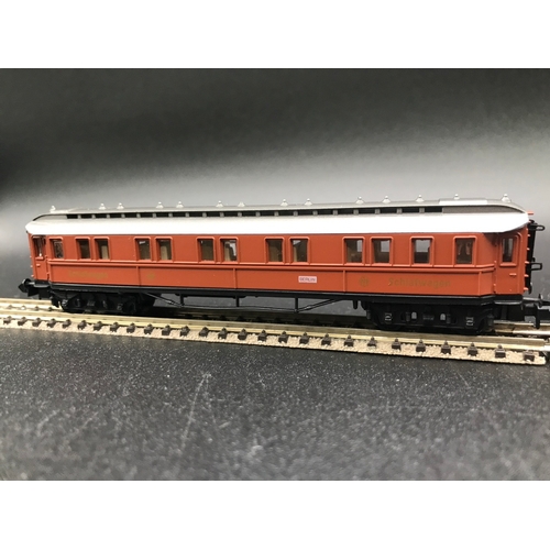 391 - Two 'N' Gauge Rakes, Arnold Speisewagen (3) Good, with Trix SNCF (4) Fair, plus two Trix Coaches, 'R... 