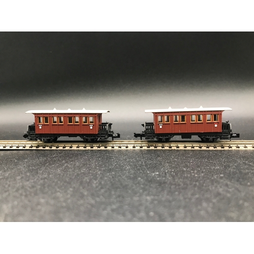 391 - Two 'N' Gauge Rakes, Arnold Speisewagen (3) Good, with Trix SNCF (4) Fair, plus two Trix Coaches, 'R... 