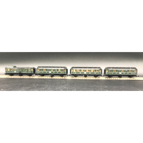 395 - Two 'N' Gauge Trix Rakes of Four and Three Cars/Coaches, Munchen Hamburg 6 Wheel coaches (Very Good)... 