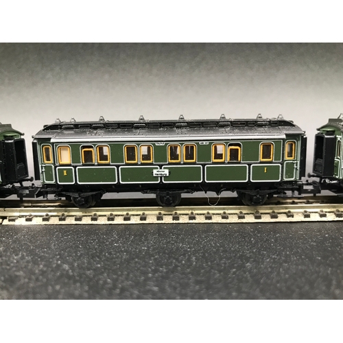 395 - Two 'N' Gauge Trix Rakes of Four and Three Cars/Coaches, Munchen Hamburg 6 Wheel coaches (Very Good)... 