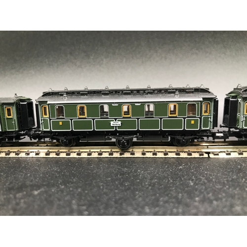 395 - Two 'N' Gauge Trix Rakes of Four and Three Cars/Coaches, Munchen Hamburg 6 Wheel coaches (Very Good)... 