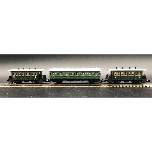 395 - Two 'N' Gauge Trix Rakes of Four and Three Cars/Coaches, Munchen Hamburg 6 Wheel coaches (Very Good)... 