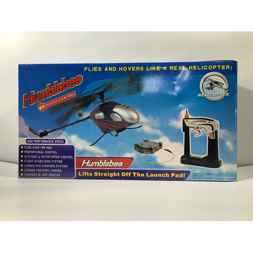 140 - Four Radio Controlled Helicopter, Spitfire style aeroplane and two Minis, Appear as New and not remo... 