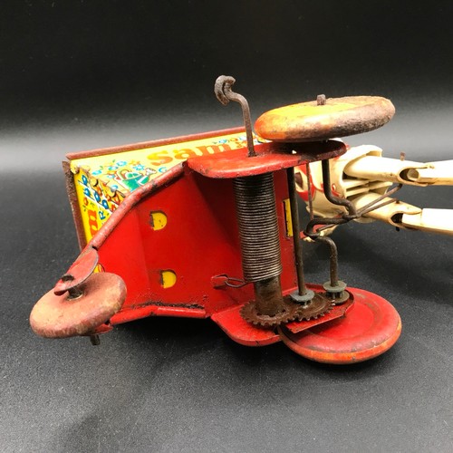 142 - A Marx Toys Sam The Gardener, tinplate and plastic model comprising of red and yellow wheelbarrow wi... 