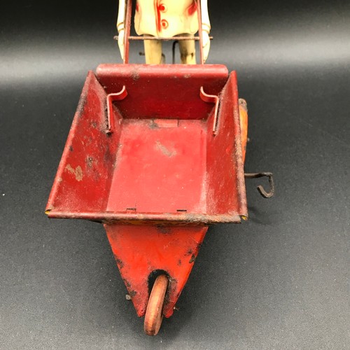 142 - A Marx Toys Sam The Gardener, tinplate and plastic model comprising of red and yellow wheelbarrow wi... 