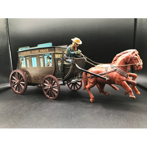 143 - Tin plate Overland Stage Coach Horse Drawn TIN TOY. 17.7 x 7.8 x 5ins. Made in Japan, Battery Operat... 