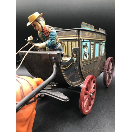 143 - Tin plate Overland Stage Coach Horse Drawn TIN TOY. 17.7 x 7.8 x 5ins. Made in Japan, Battery Operat... 