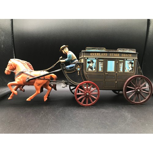 143 - Tin plate Overland Stage Coach Horse Drawn TIN TOY. 17.7 x 7.8 x 5ins. Made in Japan, Battery Operat... 