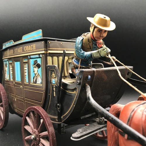 143 - Tin plate Overland Stage Coach Horse Drawn TIN TOY. 17.7 x 7.8 x 5ins. Made in Japan, Battery Operat... 