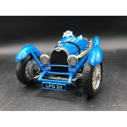 510 - Three 1:18 Burago un-boxed open-top Sports cars, Jaguar 'E' (1961), Bugatti Type '59' (1934), Jaguar... 