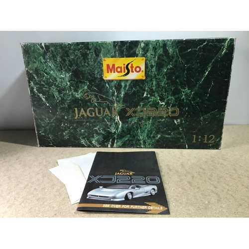 502 - Maisto 1:12 Jaguar XJ220 1992 in Silver, Boxed, Documentation and Plinth - Die-cast Good, Box Fair (... 