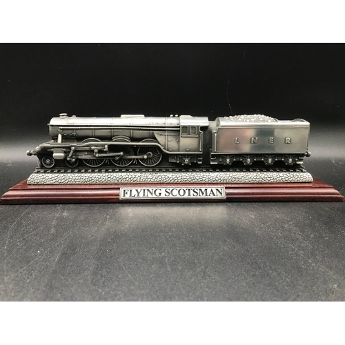 295 - A Flying Scotsman Pewter Sculpture by Compulsion Gallery on a wooden plinth and custom case, along w... 