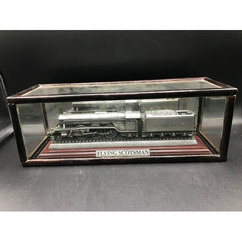 295 - A Flying Scotsman Pewter Sculpture by Compulsion Gallery on a wooden plinth and custom case, along w... 