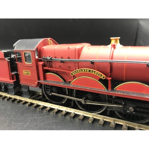 154 - Hornby 'OO' Castle Class 4-6-0 'Hogwarts Castle' 5972 in Red with four Harry Potter Hogwarts Railway... 