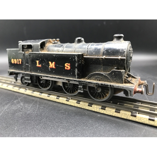 113 - A Rare Pre-war Hornby Dublo OO gauge Clockwork 0-6-2T No. 6917 in LMS black livery, Cogs appear work... 