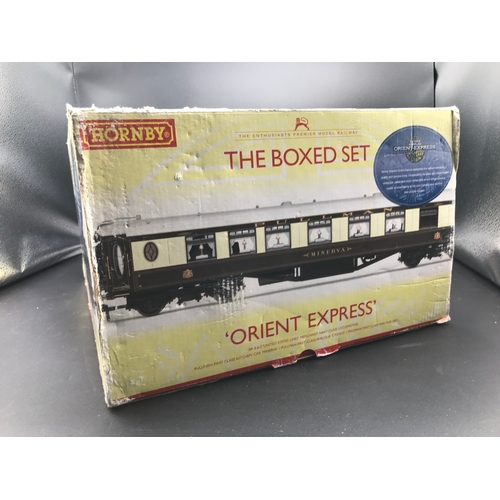 123 - Boxed Hornby OO gauge R1038 The Boxed Set Orient Express, Tested Runner, Coaches showing dust and gl... 