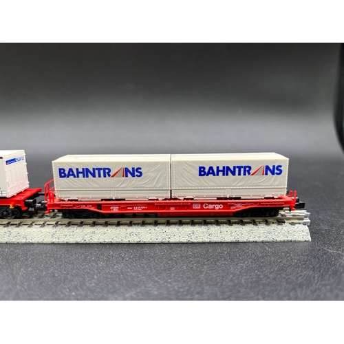 273 - An 'N' Gauge DB Cargo train of six Rolling-stock of various manufacturers with loads shown, two Flei... 