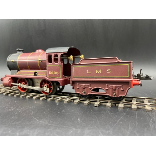 39 - Hornby Meccano Type 501 Clockwork 0-4-0 LMS 5600 locomotive with tender, LMS lined livery, slight pa... 