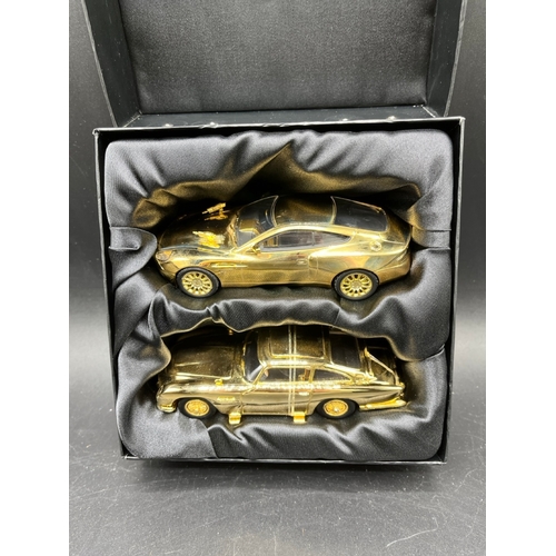 594 - CORGI & BOND 40th Anniversary twin set of gold Aston Martin model cars a DB5 and a V12 Vanquish, V12... 