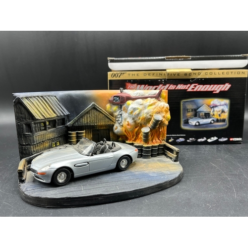 594 - CORGI & BOND 40th Anniversary twin set of gold Aston Martin model cars a DB5 and a V12 Vanquish, V12... 