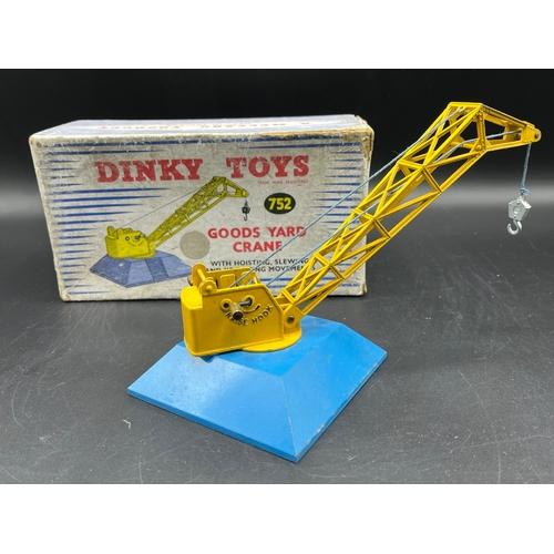 606 - Dinky Toys 752 Goods Yard Crane (Good) operable with box (Fair), together with various Dinky accesso... 