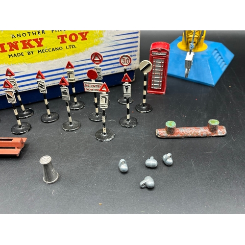 606 - Dinky Toys 752 Goods Yard Crane (Good) operable with box (Fair), together with various Dinky accesso... 