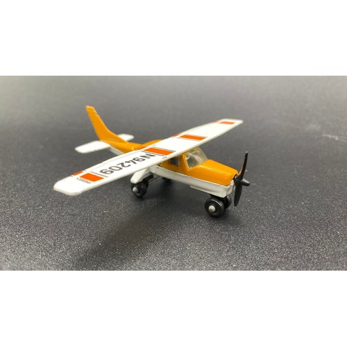 609 - Nine Matchbox Aircraft , Motorbike and Cruiser. (G). 1400g.  
Matchbox Cessna 210 White/Yellow Boxed... 