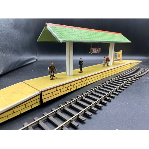 67 - Three Hornby O gauge tin plate trackside buildings and to include 13 O Gauge Dinky Figures shown in ... 