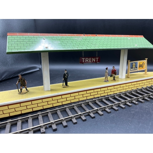 67 - Three Hornby O gauge tin plate trackside buildings and to include 13 O Gauge Dinky Figures shown in ... 