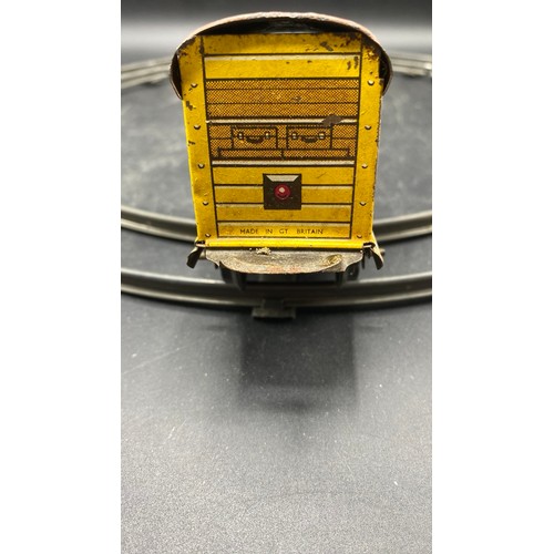 70 - Mettoy Goods Train set includes a circular track of four pieces, Red Tin-plate clockwork loco with t... 