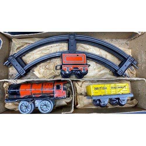 70 - Mettoy Goods Train set includes a circular track of four pieces, Red Tin-plate clockwork loco with t... 