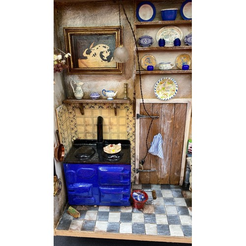 733 - Miniature Detailed Kitchen Shadow Box with lighting. G. 2000g. (1)
A few minor repairs required and ... 