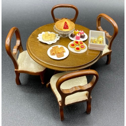 725 - Cake Shop. VG. 620g. (36)
Includes: Display Shelves, Side Board, Dining Table and 4 Chairs, 2 Charge... 