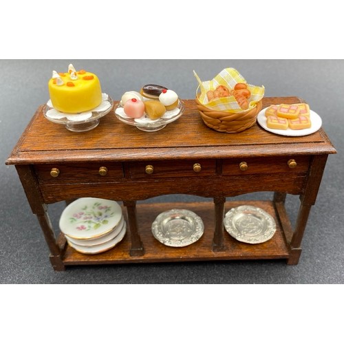 725 - Cake Shop. VG. 620g. (36)
Includes: Display Shelves, Side Board, Dining Table and 4 Chairs, 2 Charge... 