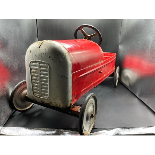 658 - A vintage metal child’s peddle car, to be enjoyed as original or restored, Steering and Peddle actio... 