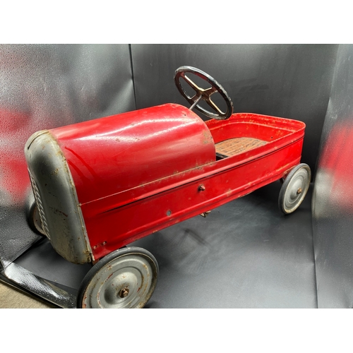 658 - A vintage metal child’s peddle car, to be enjoyed as original or restored, Steering and Peddle actio... 