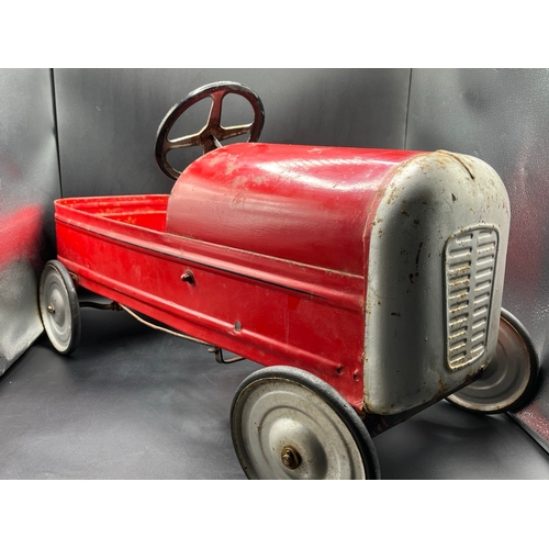 658 - A vintage metal child’s peddle car, to be enjoyed as original or restored, Steering and Peddle actio... 