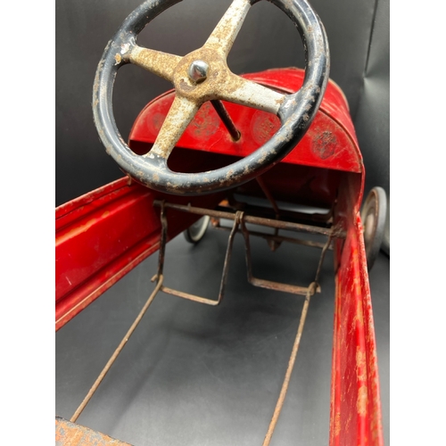 658 - A vintage metal child’s peddle car, to be enjoyed as original or restored, Steering and Peddle actio... 