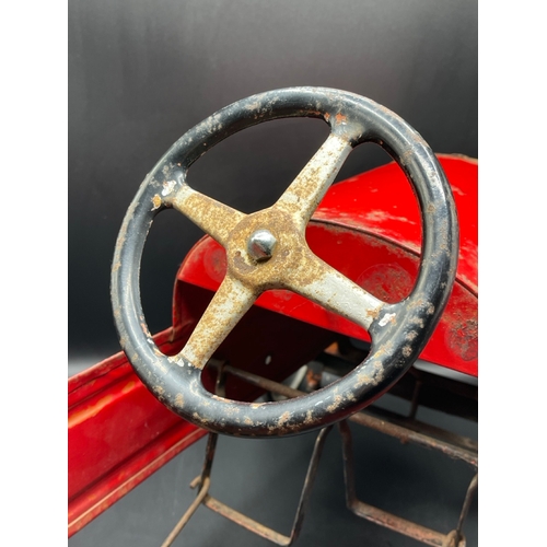 658 - A vintage metal child’s peddle car, to be enjoyed as original or restored, Steering and Peddle actio... 