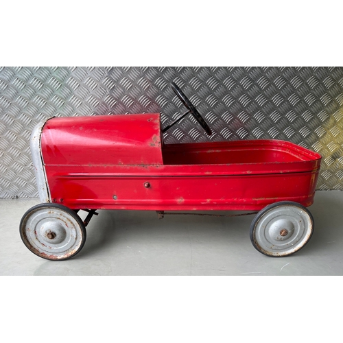 658 - A vintage metal child’s peddle car, to be enjoyed as original or restored, Steering and Peddle actio... 