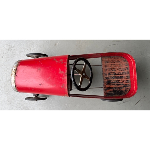 658 - A vintage metal child’s peddle car, to be enjoyed as original or restored, Steering and Peddle actio... 