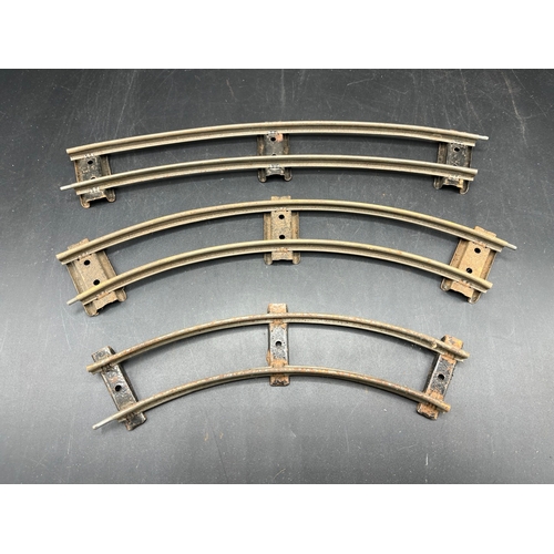 21 - A large quantity of O Gauge Hornby Clockwork track as shown, includes point junction, de-couplers, s... 