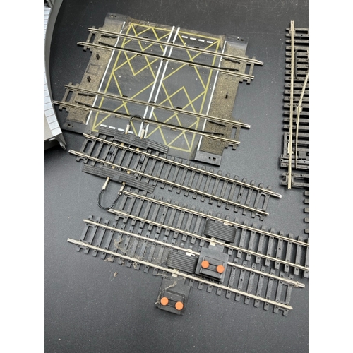 71 - A quantity of Hornby China OO gauge track, including six turn-outs, level crossing, six platform cur... 