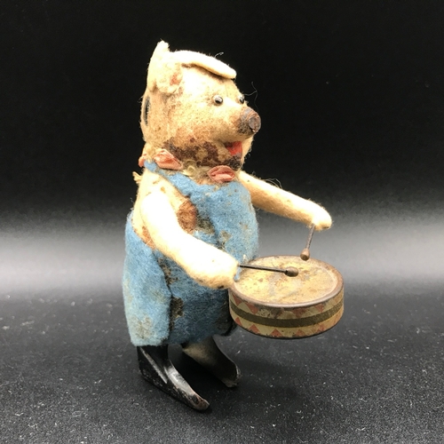 191 - Schuco Drum Playing Pig, with Schuco Tartan Dog together with Model wind up toy of a monkey playing ... 