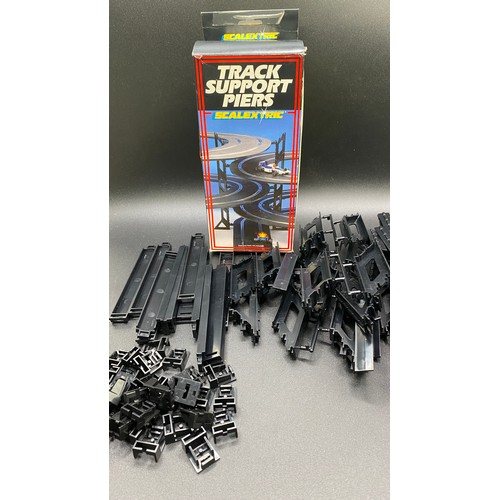 44 - Scalextric Track and Accessories (10000g). (12).
Including:
Track Support Pier Set (complete except ... 