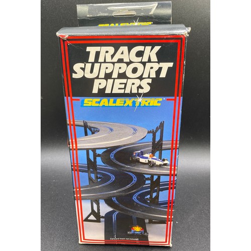 44 - Scalextric Track and Accessories (10000g). (12).
Including:
Track Support Pier Set (complete except ... 