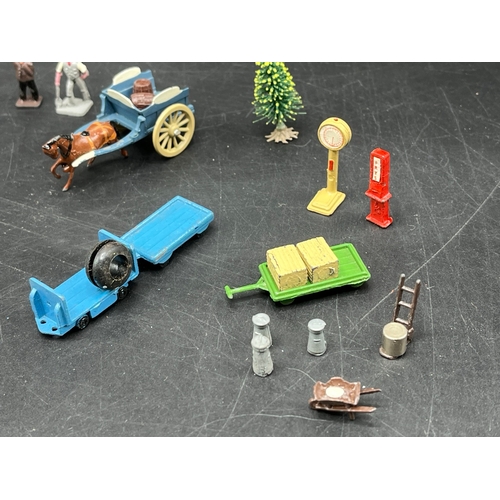 39 - OO Trackside Die-cast metal figures, bicycles, carts and tractor, with 11 Dinky Toys No.7067 tyres
(... 